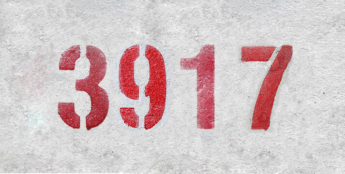 red spray-painted number 3917 sprayed onto a white wall.