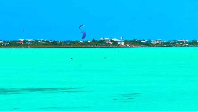 Kite surfing on Long Bay captured with a zoom lens via drone
