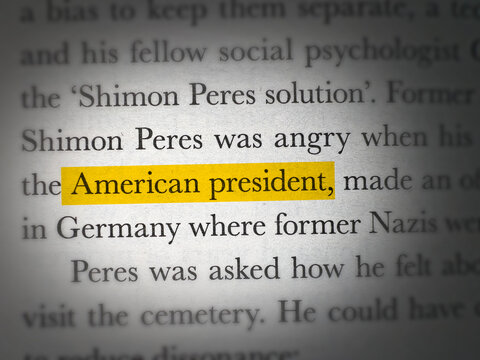 Close up of book page with highlighted text American president concept background isolated backdrop