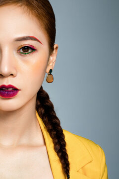 Woman with colorful makeup and braided hair