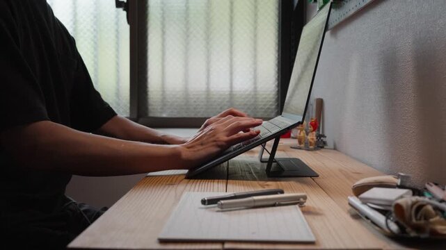 Typing on Tablet Keyboard Side View at Desk Slow Motion 4K