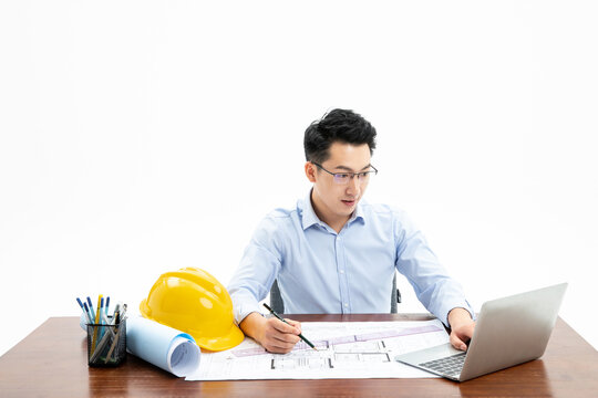 Architect Working on Building Plans