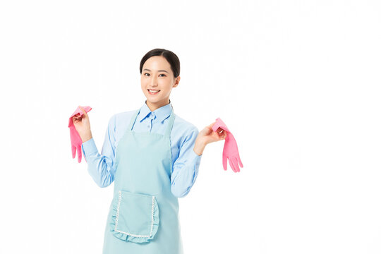 Woman in Apron Holding Pink Gloves