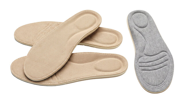Orthopedic shoe insoles for comfort, ergonomic foam footbed inserts, beige and grey cushioned inner soles isolated on white background
