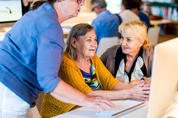 Seniors learning computer skills together