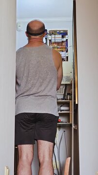 Timelapse of Man with Headlamp Working on Home Electrical Panel and Connecting Wires