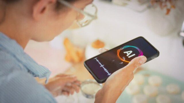 A voice assistant on a smartphone helps a housewife prepare cottage cheese pancakes in a home kitchen. Concept of modern technology and artificial intelligence in everyday domestic life