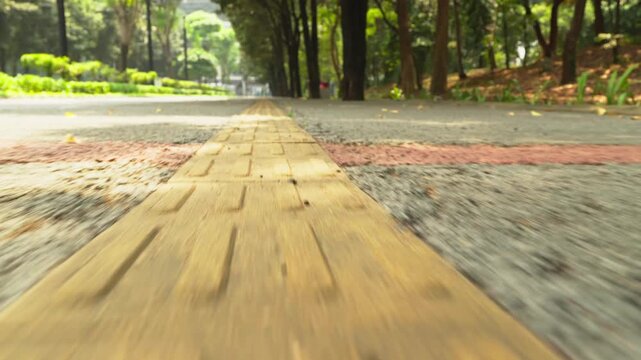 Yellow tactile paving guiding visually impaired pedestrians