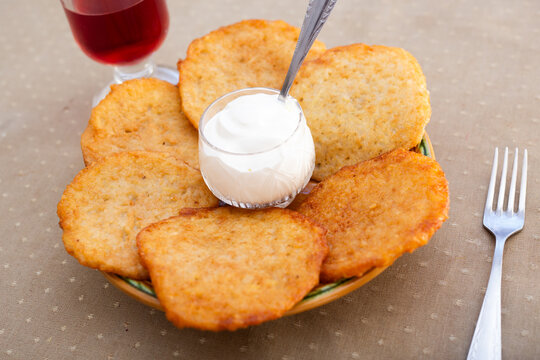 Crispy Potato Pancakes with Cream Topping