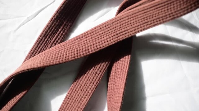 Martial arts belts copy space background, belt kimono martial arts ranking, authentic real life backgrounds