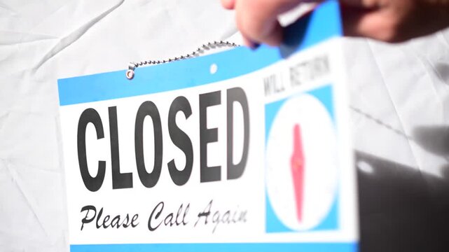 Business hours closed sign copy space background image, bokeh soft focus backdrop of sign letters, economy industry concept, sign on white background flipping from open to closed, will return at 12.30