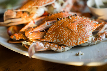 Steamed crabs in ceramic plate, you can dip with chili sauce. Thai Food © Dontree