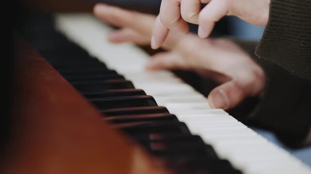 The female pianist plays the piano outside on city street at night,cinematic isolated slow motion shot