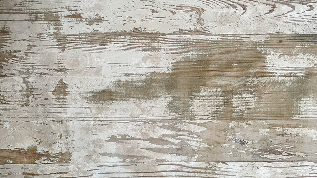 Old white-painted wood planks with broad scraped areas, exposed beige grain, and soft patchy wear in a horizontal format