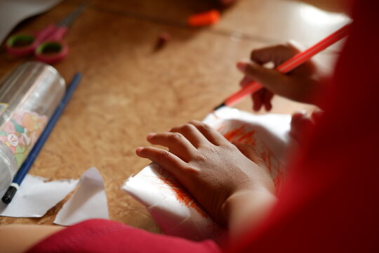 Children sitting together playing and learning in a colorful classroom environment
