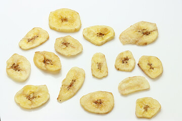 Dried Banana Chips assorted on white background © Thomas Montini