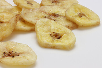 Dried Banana Chips assorted on white background © Thomas Montini