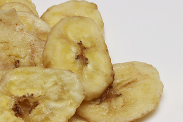 Dried Banana Chips assorted on white background © Thomas Montini