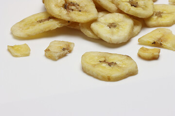 Dried Banana Chips assorted on white background © Thomas Montini
