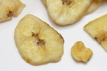 Dried Banana Chips assorted on white background © Thomas Montini