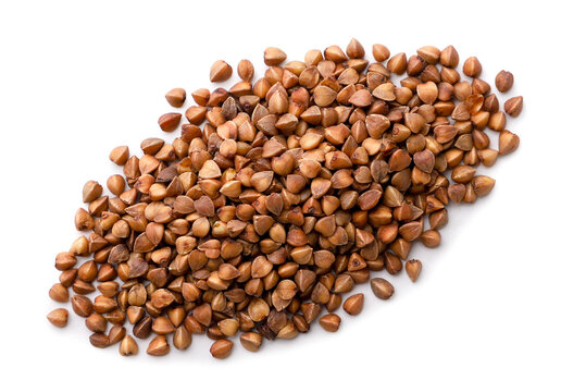 Pile of raw buckwheat on a white background. Top view