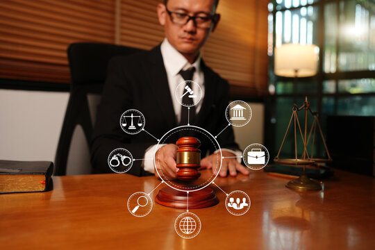 Asian Lawyer or Judge Holding Gavel with Digital Legal Technology Network Icons