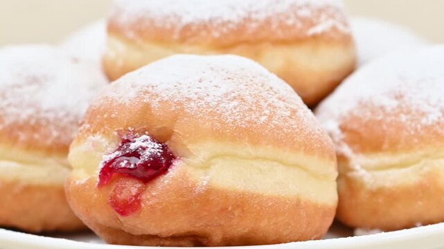 Video of Berliners (German donuts) with raspberry jam