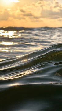 Golden hour light reflecting on calming ocean waves, creating a tranquil water background representing peace, nature, and relaxation concepts
