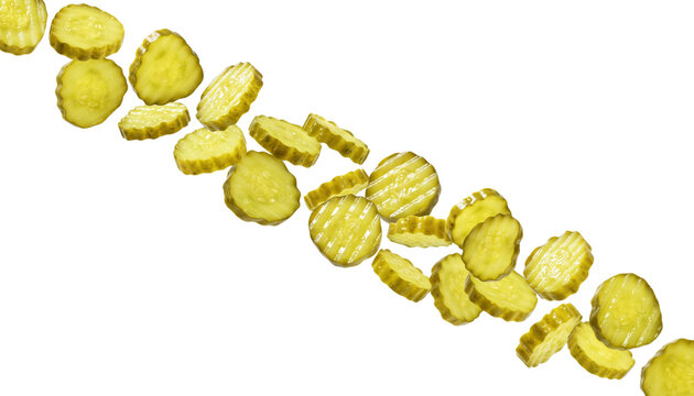Yellow pickle slices falling in a diagonal line on transparent background