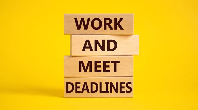 Work and meet deadlines text on wooden blocks. Business productivity concept on yellow background. Time management and professional goals.