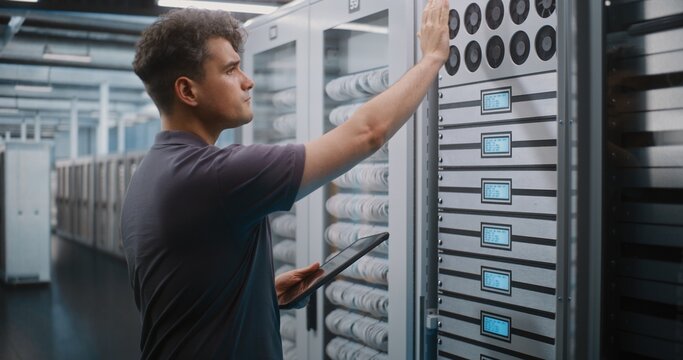 IT Specialist Holds Digital Tablet and Uses Keys to Open Glass Server Cabinet Door Inspect Cooling Fans and Hardware Components. System Diagnostics, Physical Maintenance Ensure Optimal Server Airflow.