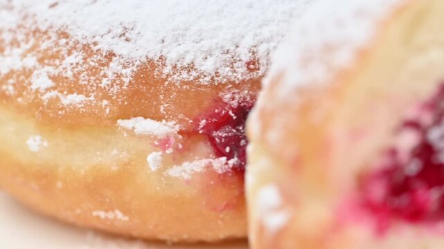 Video of Berliners (German donuts) with raspberry jam