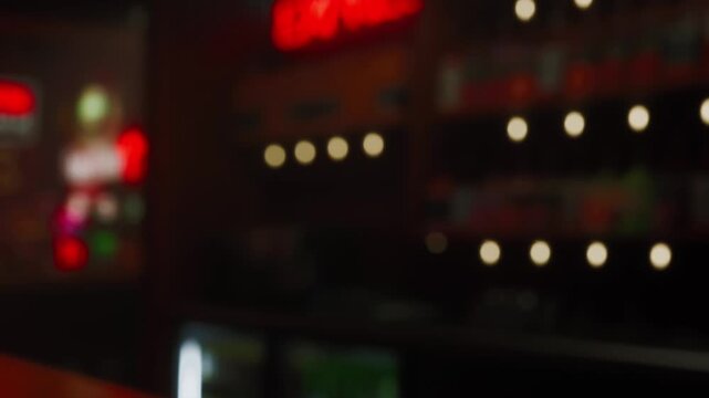 A vibrant local cafe buzzes with life as warm lights glow softly in the background. Patrons enjoy drinks and conversations, embracing a relaxed ambiance during evening hours.