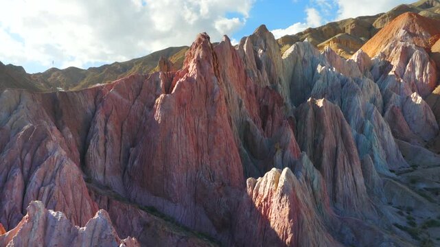 Aerial view of colorful Danxia landform, exotic rocky peaks in Zhangye, Gansu, China
Drone shot of magnificent alien‑valley rock formations, multicolored mountain landscape under blue sky