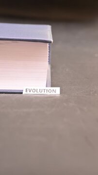 Evolution Text on Book Pages Growth and Transformation Concept Footage