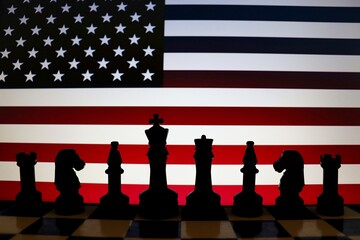United States flag behind chess knight pieces. Strategy and international relations concept. © Blossom Stock Studio
