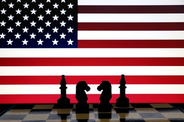 United States flag behind chess knight pieces. Strategy and international relations concept. © Blossom Stock Studio