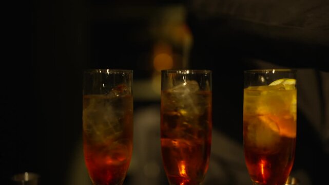 Waiter Carrying Elegant Aperol Spritz Cocktails on Tray at Luxury Event Reception