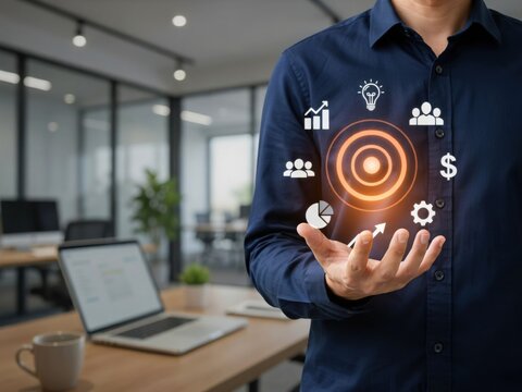 A Professional Holding Digital Business Strategy Icons Over A Modern Office Background
