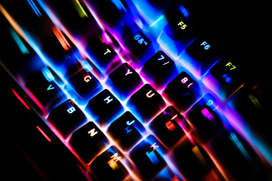 Gaming mechanical keyboard with vibrant RGB lighting and motion blur
