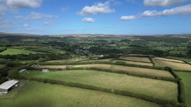 Hemerdon, Devon, England: DRONE VIEWS: Countryside looking towards the south-west hill ranges of Dartmoor National Park. The Park covers 368 sq. miles and achieved national park status in 1951.