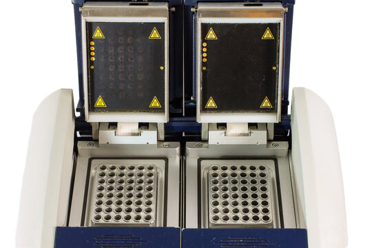 Dual-block PCR thermal cycler with two sample blocks and heated covers, used for laboratory DNA amplification and molecular biology research.