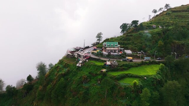 Drone flies close to Halsema Highroad Second Highest Point, rainy Atok, Benguet