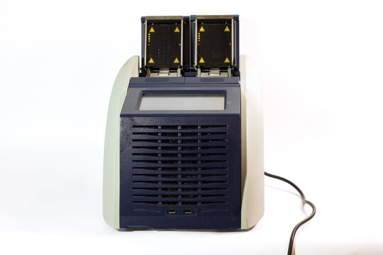 Laboratory thermal cycler with two 48-well sample blocks, heated lids and control mechanisms for PCR and scientific research.