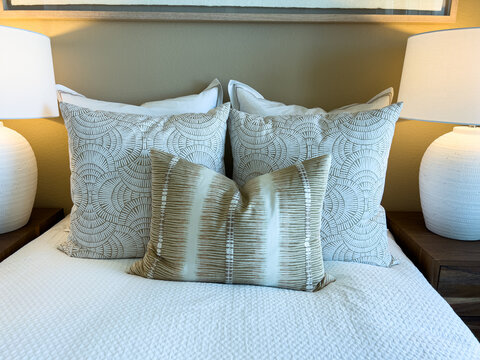 Pillows Arranged on Bed with Lamps
