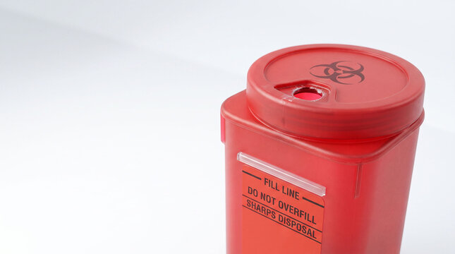 Insulin pen needle disposal box for safe storage of medical sharps and hazardous waste.