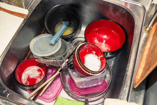Dirty Dishes Piled in Kitchen Sink