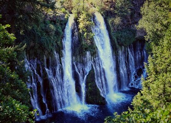 Twin Cascades of Burney Falls Flowing Over Mossy Basalt Cliffs at McArthur-Burney Falls State Park © Nick