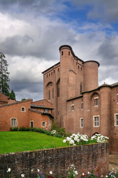 Low angle view of Berbie Palace in Albi, France. Brick architecture of Toulouse-Lautrec Museum under cloudy sky
