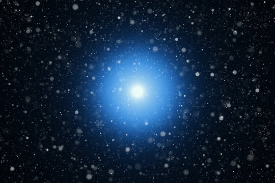 Falling Snow and Glowing Light on a Winter Background